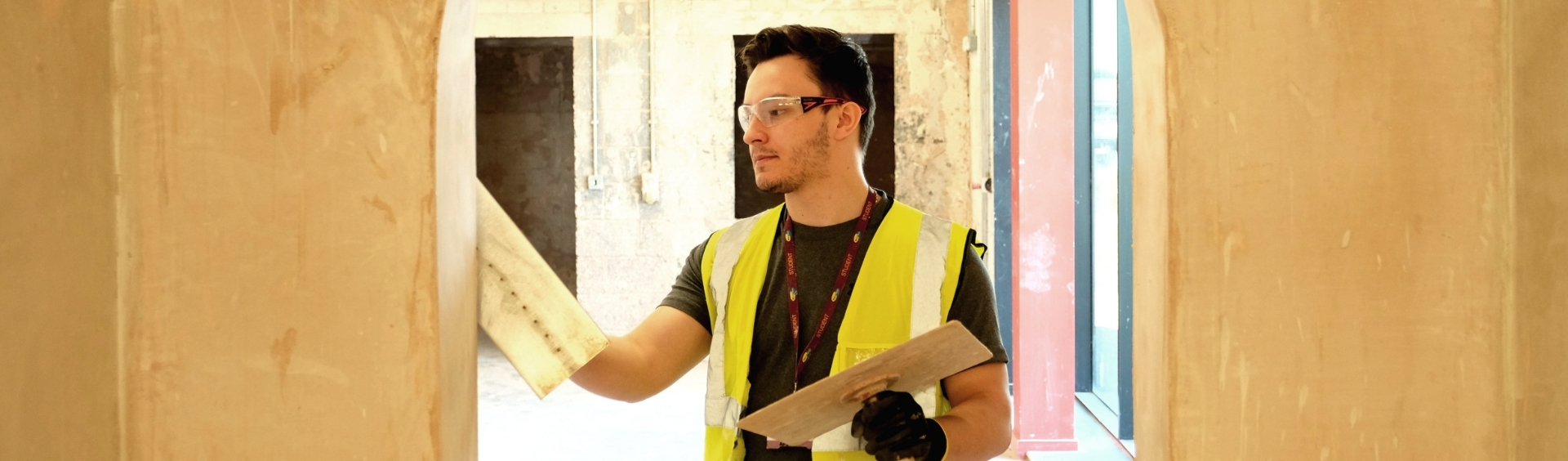 WMC Plastering Diploma student working on a wall