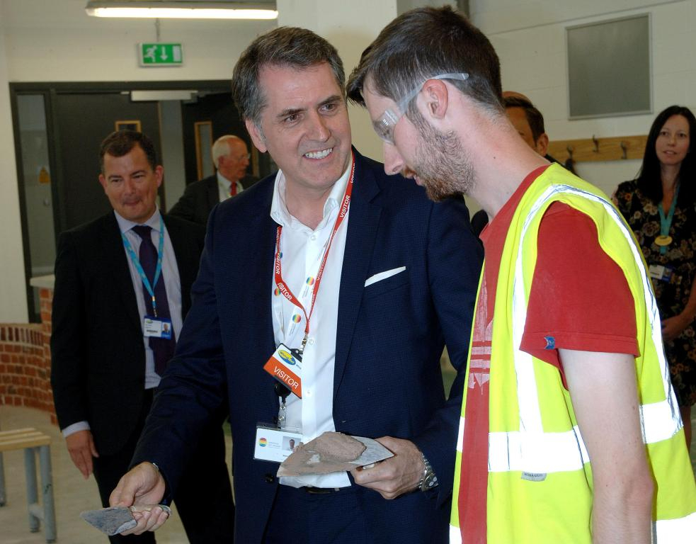 Metro Mayor Steve Rotheram meeting a Student wearing Hi-Vis Jacket