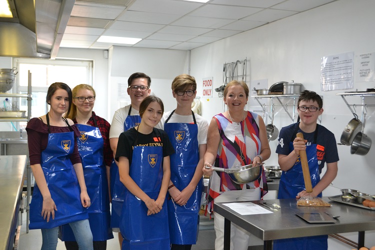  Bake Off Contenders standing next to Principle Sue at Wirral Met Conway Park Campus