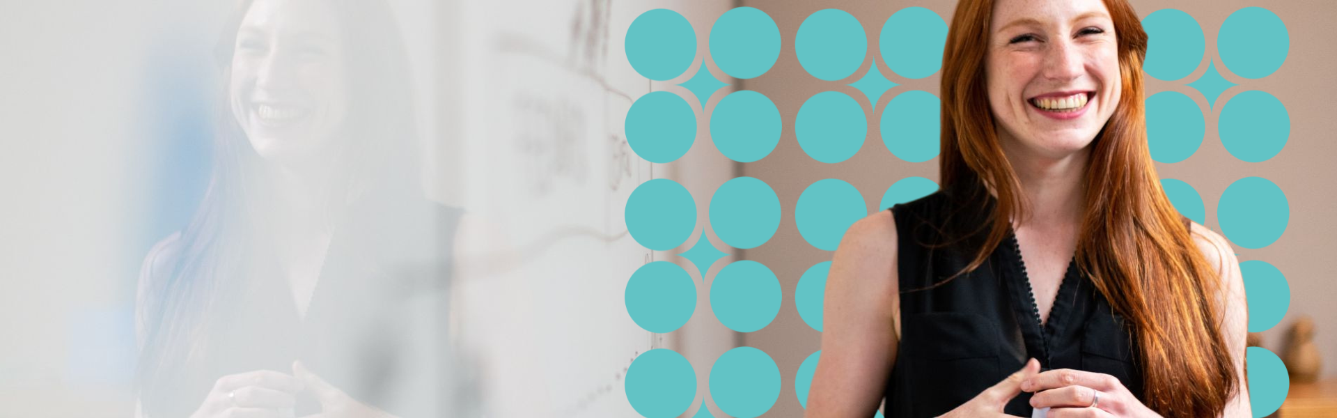 A teacher smiling stood in front of a whiteboard 